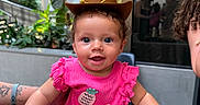 Mckinleigh joined the competition — help win amazing prizes! baby, child, infant, cowboy_hat, pink_outfit, pineapple, smiling, happy, portrait, indoor, lobby, plants, adult, hands, held, cowboy, sheriff, fashion, cute, photography