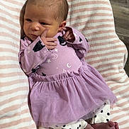 Kaiya joined the competition — help win amazing prizes! baby, newborn, infant, blanket, striped, purple_dress, celestial_prints, polka_dot_pants, feet, hand, face, soft, cozy, lying_down, indoors, wood_floor, cute, small, child, portrait