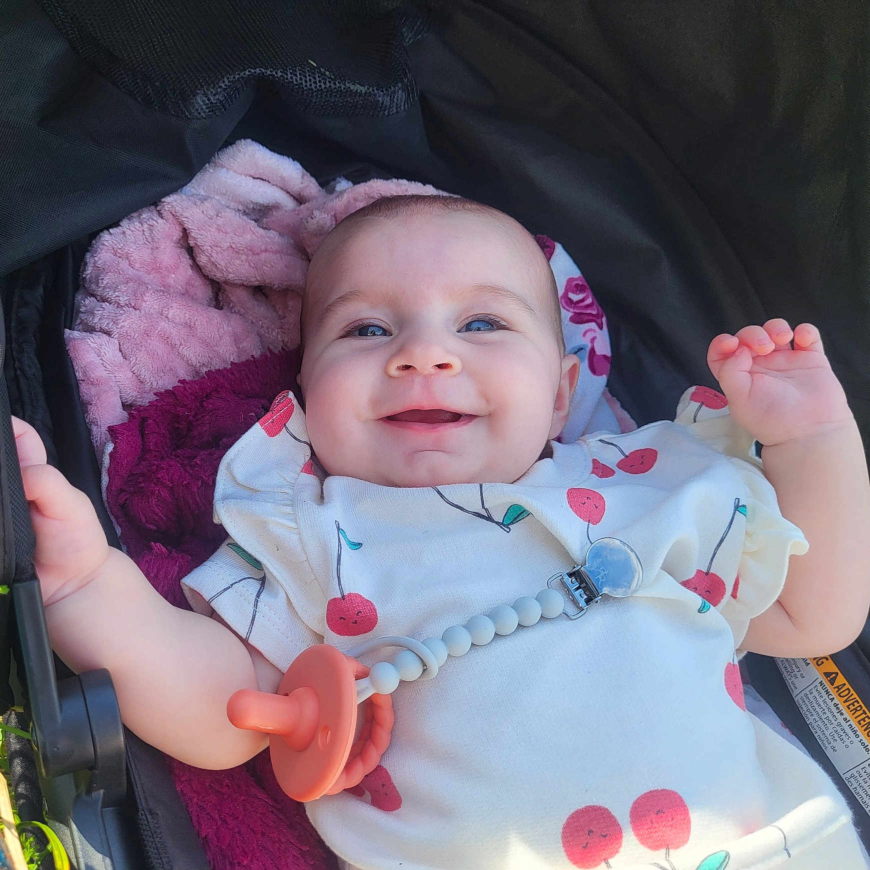 Millie joined the competition — help win amazing prizes! accessories, baby, clothing, coat, face, furniture, happy, hat, head, jacket, jewelry, laughing, necklace, newborn, person, photography, portrait, smile, stroller, t_shirt
