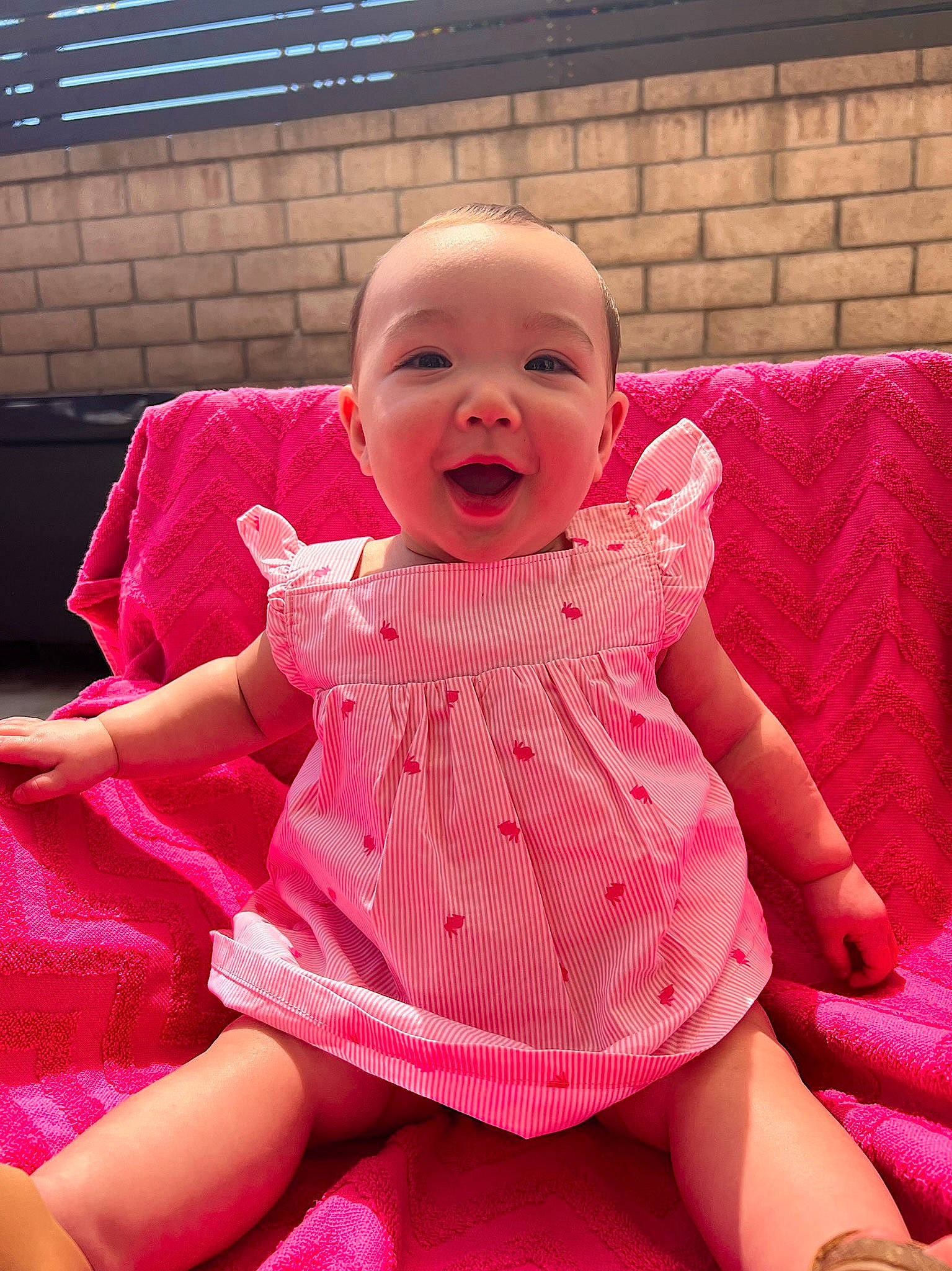 Reyna joined the competition — help win amazing prizes! baby, baby_toddler_clothing, blond, cheek, dress, fun, grass, happy, human_leg, leg, leisure, magenta, pattern, person, pink, purple, skin, sleeve, smile, thigh