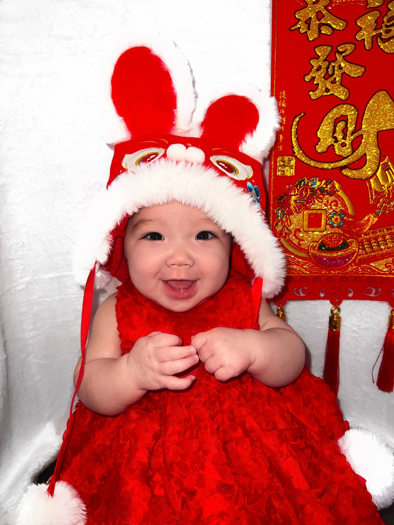 Reyna is registered to the contest to win money with this photo: baby_toddler_clothing, christmas, christmas_eve, costume_hat, event, facial_expression, fictional_character, fun, fur, happy, headgear, headpiece, headwear, holiday, magenta, person, pink, red, smile, textile