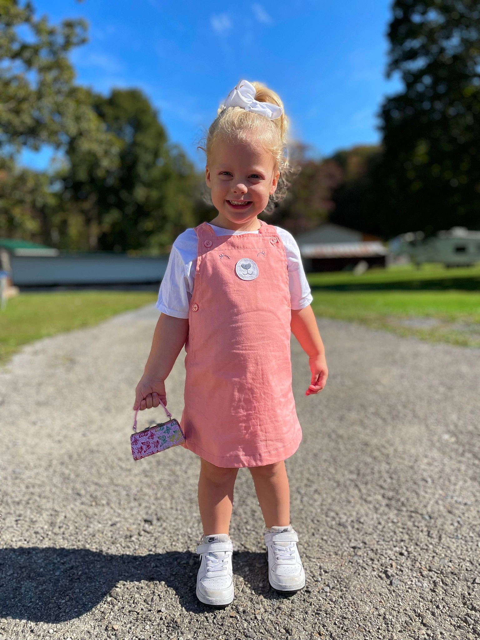 Izabella is registered to the contest to win money with this photo: asphalt, baby_toddler_clothing, denim, electric_blue, footwear, fun, grass, grassland, happy, joy, landscape, lawn, leisure, people_in_nature, person, plant, recreation, sky, sleeve, t_shirt