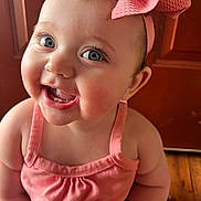 Collins joined the competition — help win amazing prizes! baby, child, smiling, pink_bow, blue_eyes, cute, indoors, portrait, happy, infant, closeup, pink_clothing, toddler, cheerful, face, skin, headband, person, baby_girl, teeth