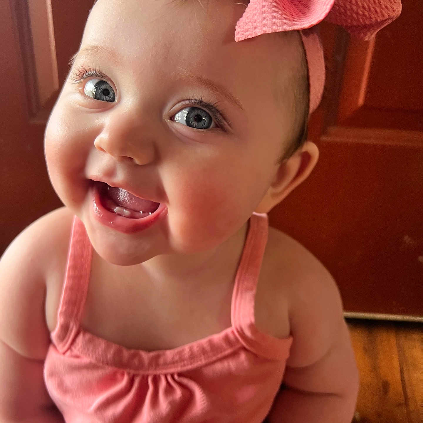 Collins joined the competition — help win amazing prizes! baby, child, smiling, pink_bow, blue_eyes, cute, indoors, portrait, happy, infant, closeup, pink_clothing, toddler, cheerful, face, skin, headband, person, baby_girl, teeth