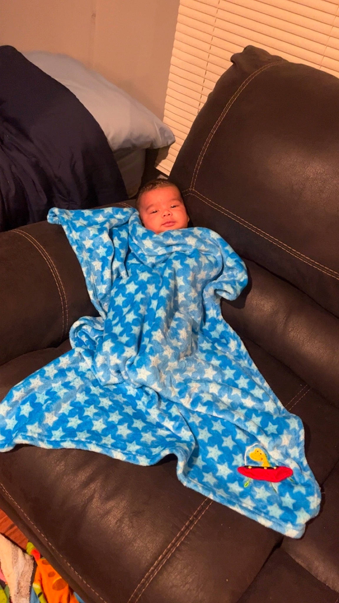 Kamden joined the competition — help win amazing prizes! baby_toddler_clothing, chair, club_chair, comfort, couch, electric_blue, furniture, futon_pad, human_leg, knee, leisure, linens, living_room, pattern, person, rectangle, room, sitting, thigh, throw_pillow