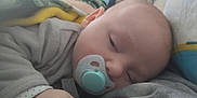 Malone participe au concours pour gagner de l'argent avec cette photo : baby, blanket, child, clothing, comfort, cozy, cute, face, hand, head, indoors, infant, pacifier, pajamas, peaceful, resting, skin, sleeping, soft, young
