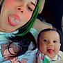 woman, baby, tongue, tongue_piercing, car_seat, selfie, green_hair, black_hair, smile, tongue_out, clothing, person, portrait, child, infant, cute, playful, indoor, seat, car