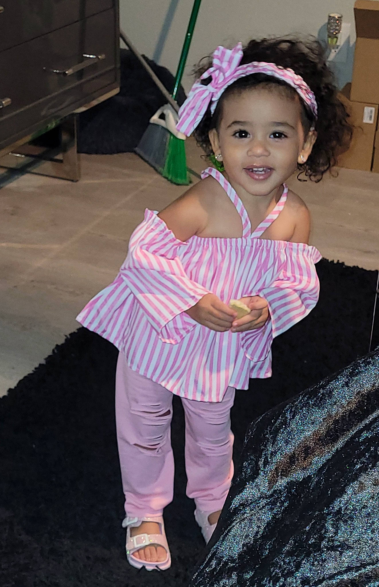 Zuri is registered to the contest to win money with this photo: baby_toddler_clothing, cabinetry, child, drawer, dress, event, eye, face, flash_photography, fun, happy, head, headband, headgear, headpiece, joy, magenta, person, pink, purple