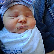 Salem joined the competition — help win amazing prizes! baby, newborn, sleeping, swaddled, blanket, bow, hat, person, denim, clothing, hospital, logo, face, cheeks, cute, infant, portrait, resting, soft, peaceful
