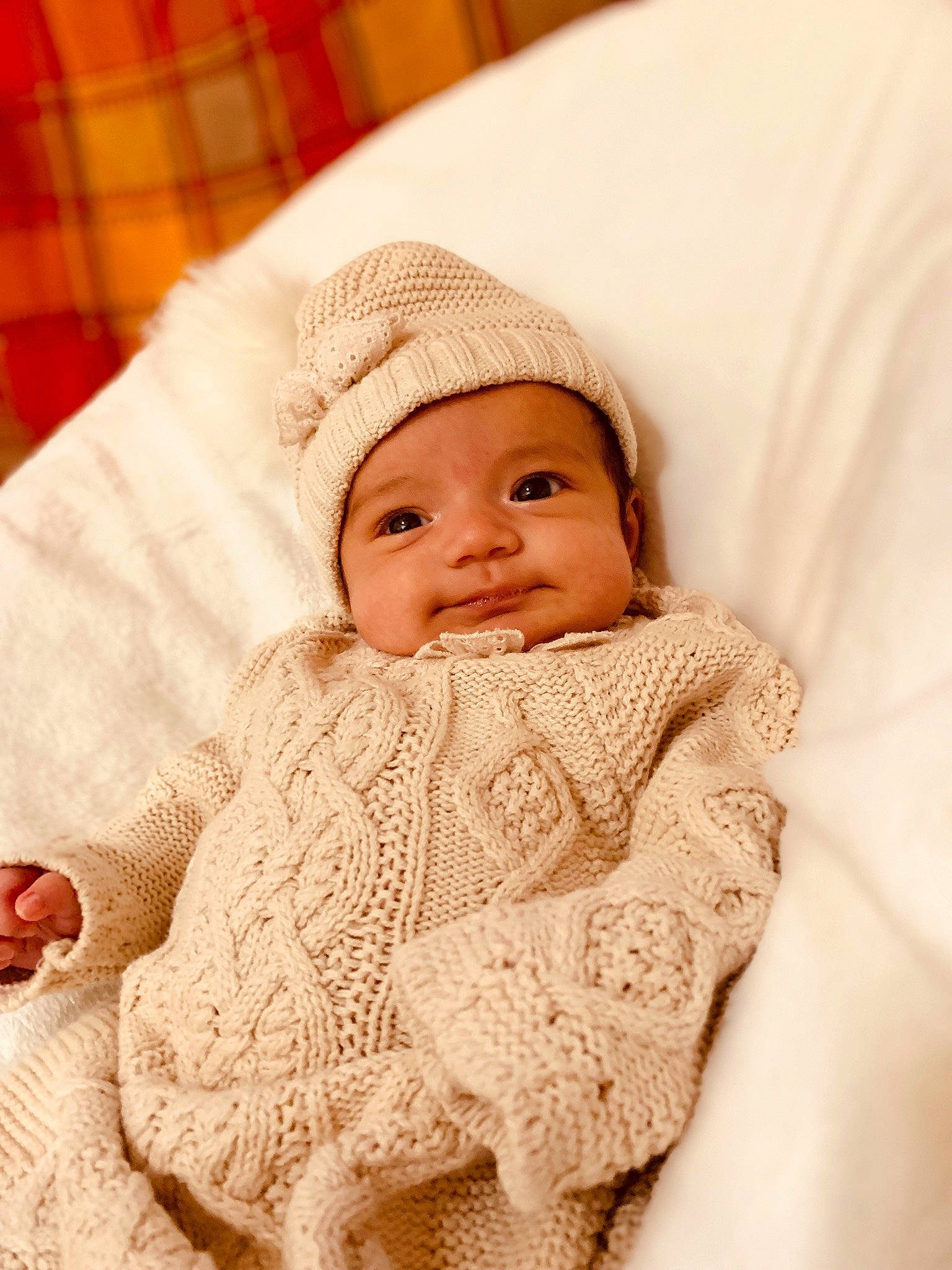 Elisa is registered to the contest to win money with this photo: baby, baby_toddler_clothing, cheek, close_up, collar, comfort, face, fashion_accessory, happy, headgear, headwear, lip, pattern, person, skin, sleeve, smile, tartan, textile, toddler