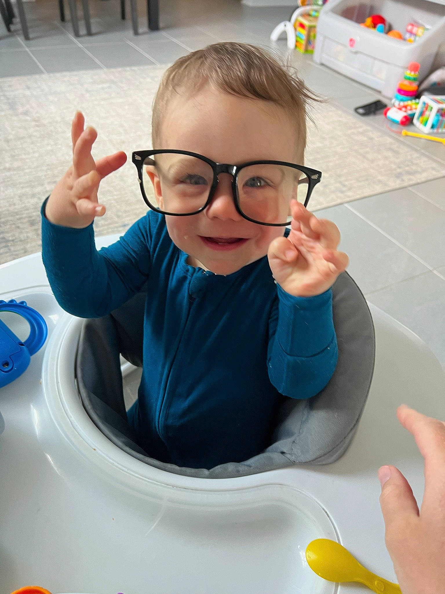 Jett is registered to the contest to win money with this photo: automotive_design, automotive_exterior, automotive_tire, car, chair, child, eyewear, finger, fun, glasses, hand, motor_vehicle, person, personal_protective_equipment, product, smile, t_shirt, thumb, toddler, vehicle