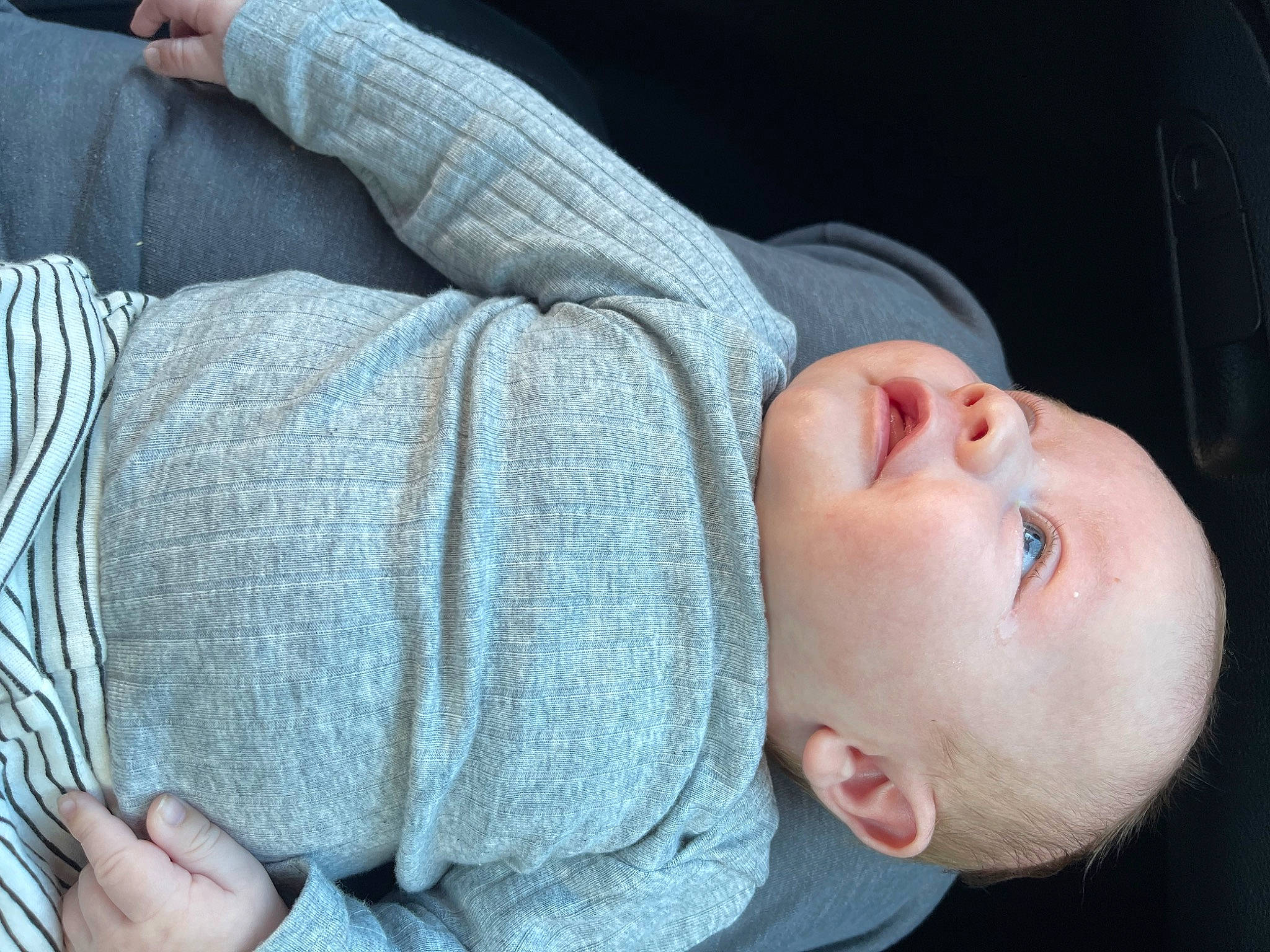 Collin is registered to the contest to win money with this photo: arm, baby, baby_toddler_clothing, beauty, cheek, comfort, finger, gesture, grass, hand, human, mammal, mouth, nose, organ, people, person, skin, sleeve, toddler