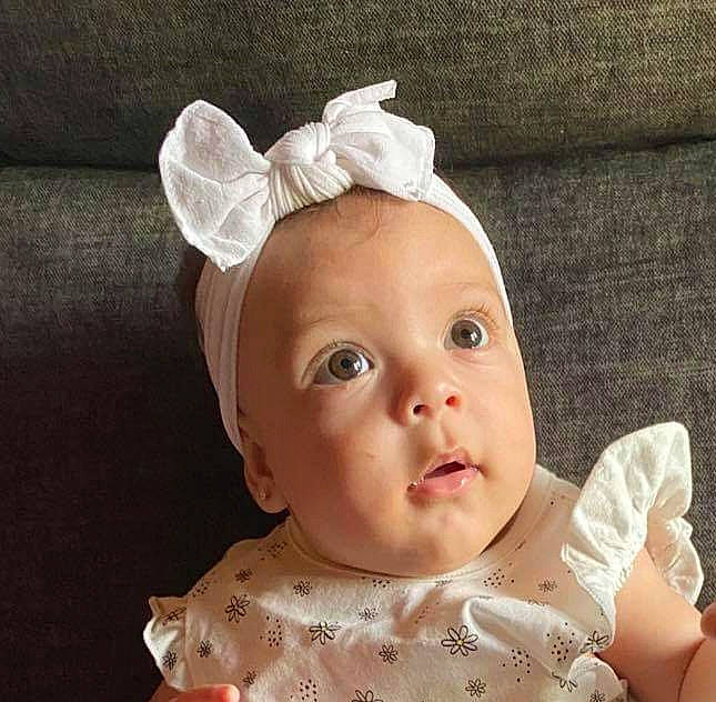 Anahí is registered to the contest to win money with this photo: baby, baby_toddler_clothing, bridal_accessory, cheek, child, costume_hat, ear, eyelash, fashion_accessory, hair_accessory, happy, headband, headgear, headpiece, jewellery, lip, peach, person, skin, sleeve