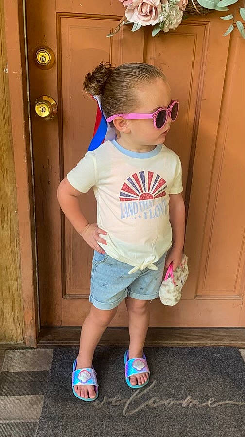 Analeigh is registered to the contest to win money with this photo: baby_toddler_clothing, electric_blue, eyewear, footwear, glasses, goggles, hair, head, person, pink, shoe, shorts, sleeve, sneakers, standing, sunglasses, t_shirt, thigh, toddler, vision_care