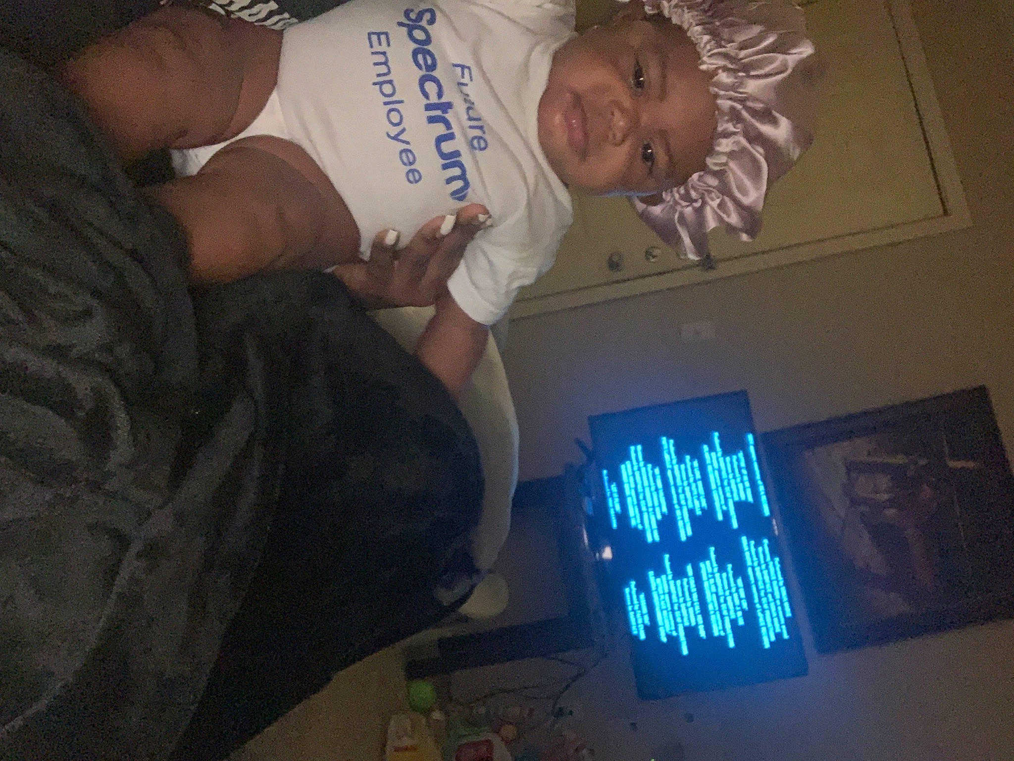 Serenity is registered to the contest to win money with this photo: baby, baby_products, baby_toddler_clothing, child, display_device, elbow, electric_blue, finger, font, fun, gadget, happy, headwear, multimedia, person, room, smile, space, t_shirt, toddler