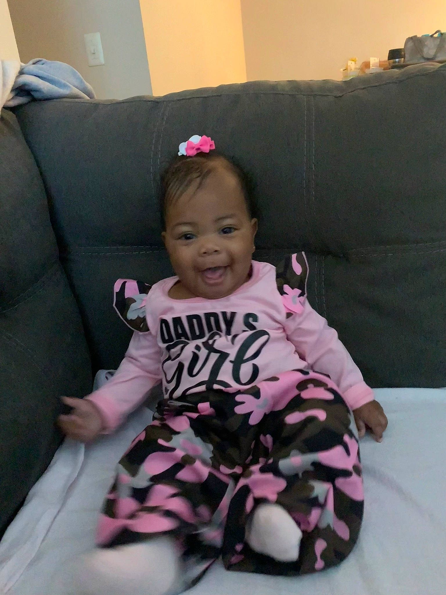 Serenity joined the competition — help win amazing prizes! baby, baby_toddler_clothing, child, comfort, couch, eye, happy, lap, leg, linens, magenta, person, pink, purple, sitting, sleeve, smile, sock, t_shirt, thigh