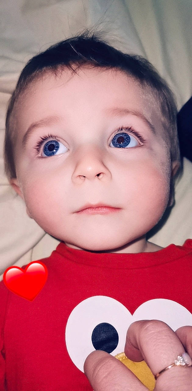 Nïgel participe au concours pour gagner de l'argent avec cette photo : baby, baby_toddler_clothing, black, cheek, chin, eye, eyebrow, eyelash, face, facial_expression, hairstyle, head, iris, lip, mouth, nose, organ, person, product, skin