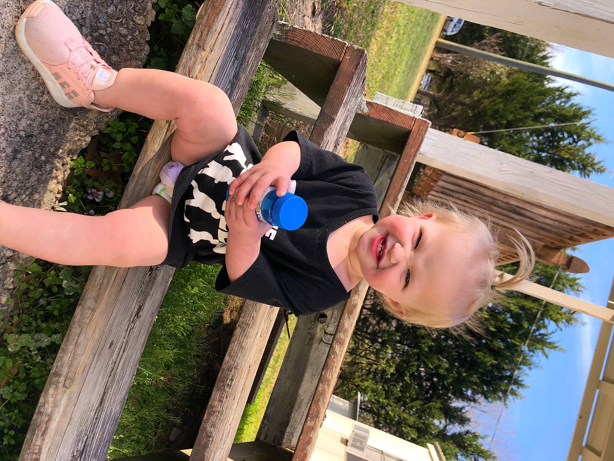 Irene joined the competition — help win amazing prizes! child, elbow, facial_expression, fun, grass, happy, house, human_leg, knee, leisure, people_in_nature, person, recreation, sky, smile, street_fashion, thigh, tree, vacation, wood