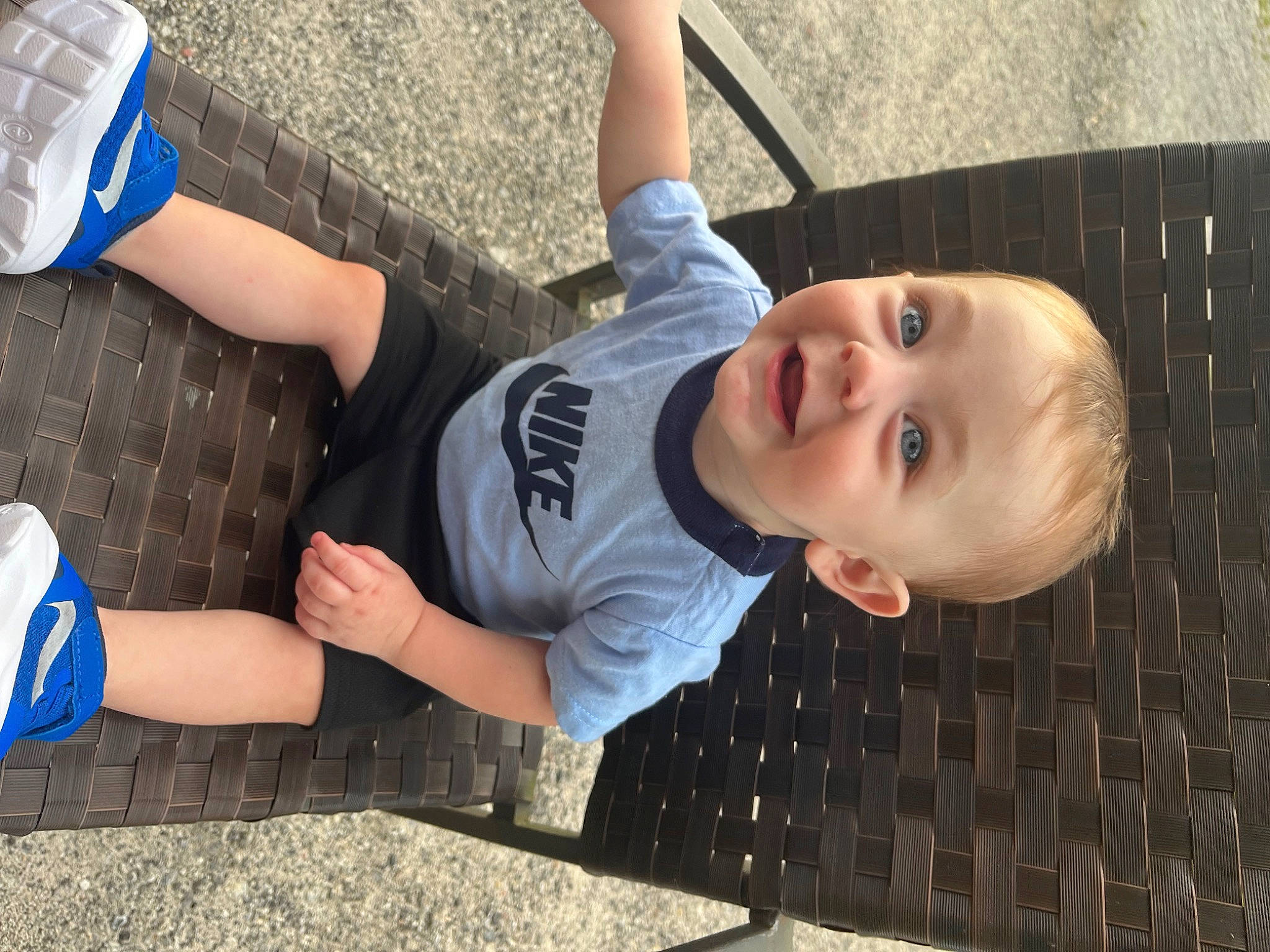 Grayson is registered to the contest to win money with this photo: baby, blue, child, elbow, foot, fun, gesture, grass, happy, human_leg, joy, knee, leisure, person, plant, sitting, smile, sports_gear, thigh, toddler