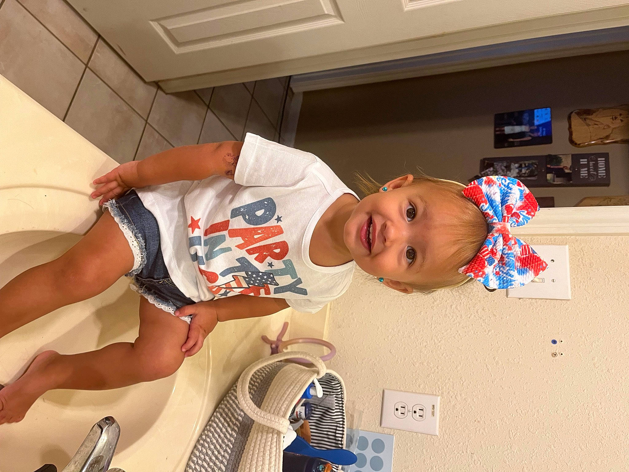 Cora joined the competition — help win amazing prizes! baby, baby_toddler_clothing, child, elbow, flooring, foot, fun, happy, hat, homemaker, human_leg, joy, kitchen_utensil, knee, mechanical_fan, mouth, person, room, smile, t_shirt