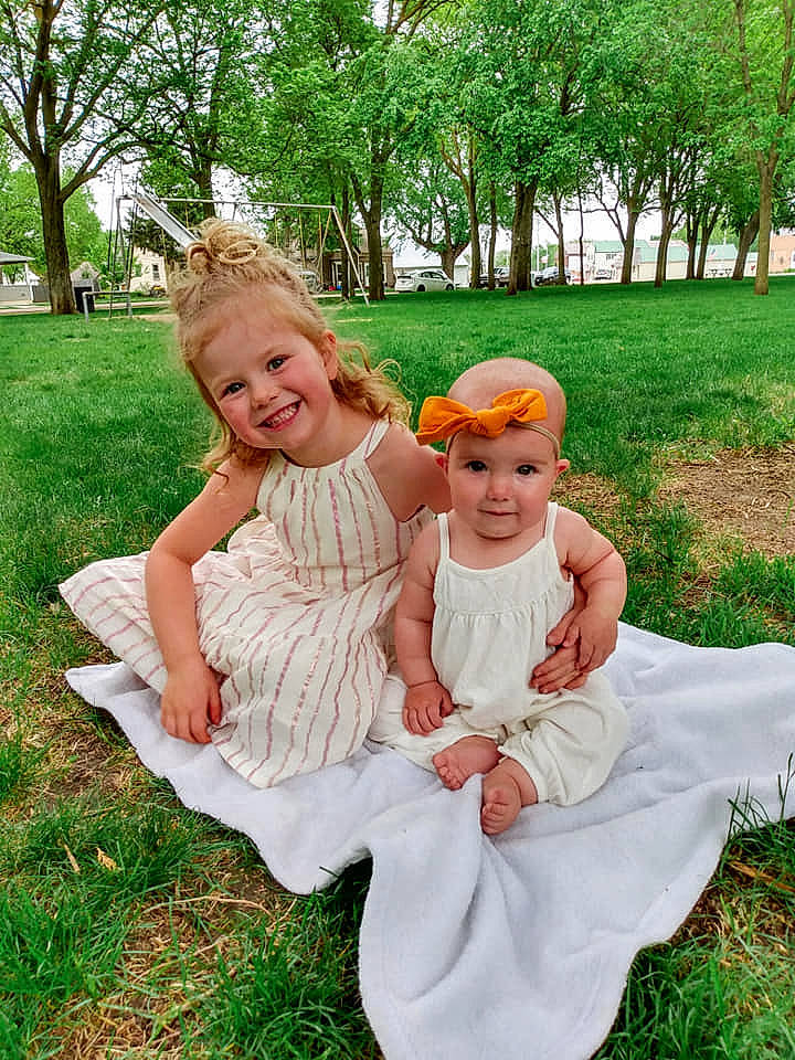 Brynlee joined the competition — help win amazing prizes! child, dress, fun, grass, happy, headwear, joy, people, people_in_nature, person, sibling, sitting, smile