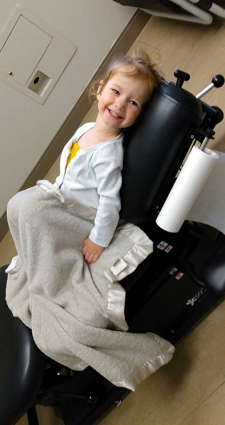 Raegan joined the competition — help win amazing prizes! arm, blond, chair, child, employment, joy, leg, massage_chair, person, sitting, toddler