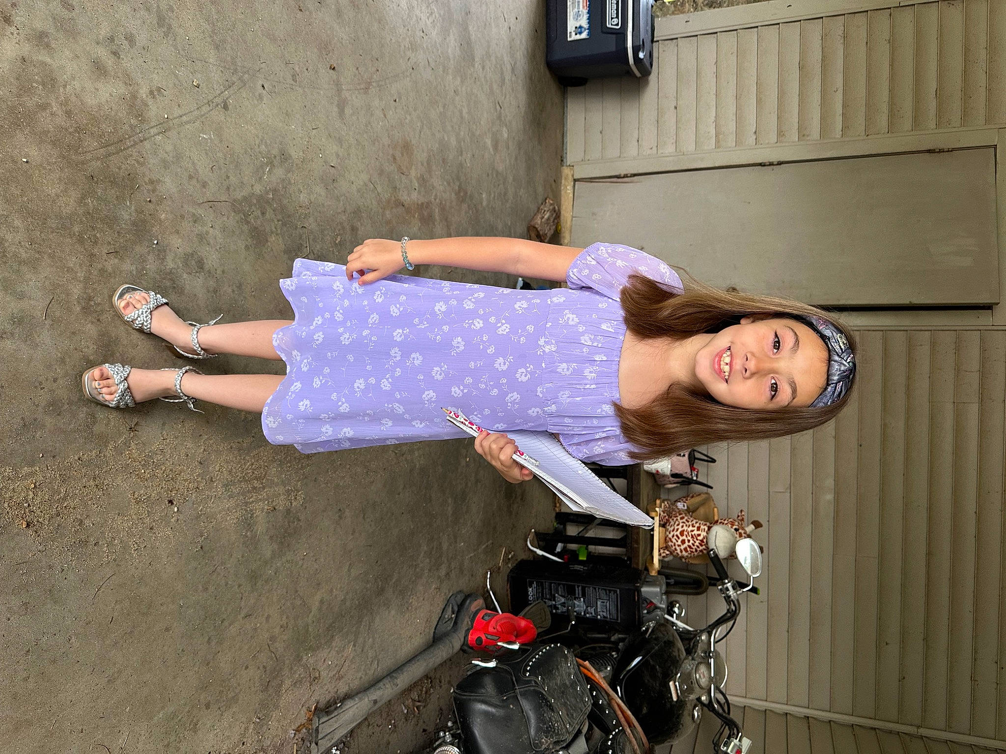 Zyriah is registered to the contest to win money with this photo: automotive_lighting, automotive_tire, baby_carriage, baby_products, dress, electric_blue, fun, human_leg, joy, motor_vehicle, person, rim, sandal, sitting, smile, thigh, travel, waist