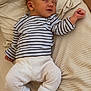 Elysio a rejoint le concours — aidez-le/la à gagner de superbes lots ! baby, newborn, sleeping, striped_shirt, pants, socks, heart, blanket, soft_texture, cozy, infant, child, cute, resting, indoors, relaxing, comfortable, person, small_hands, small_feet