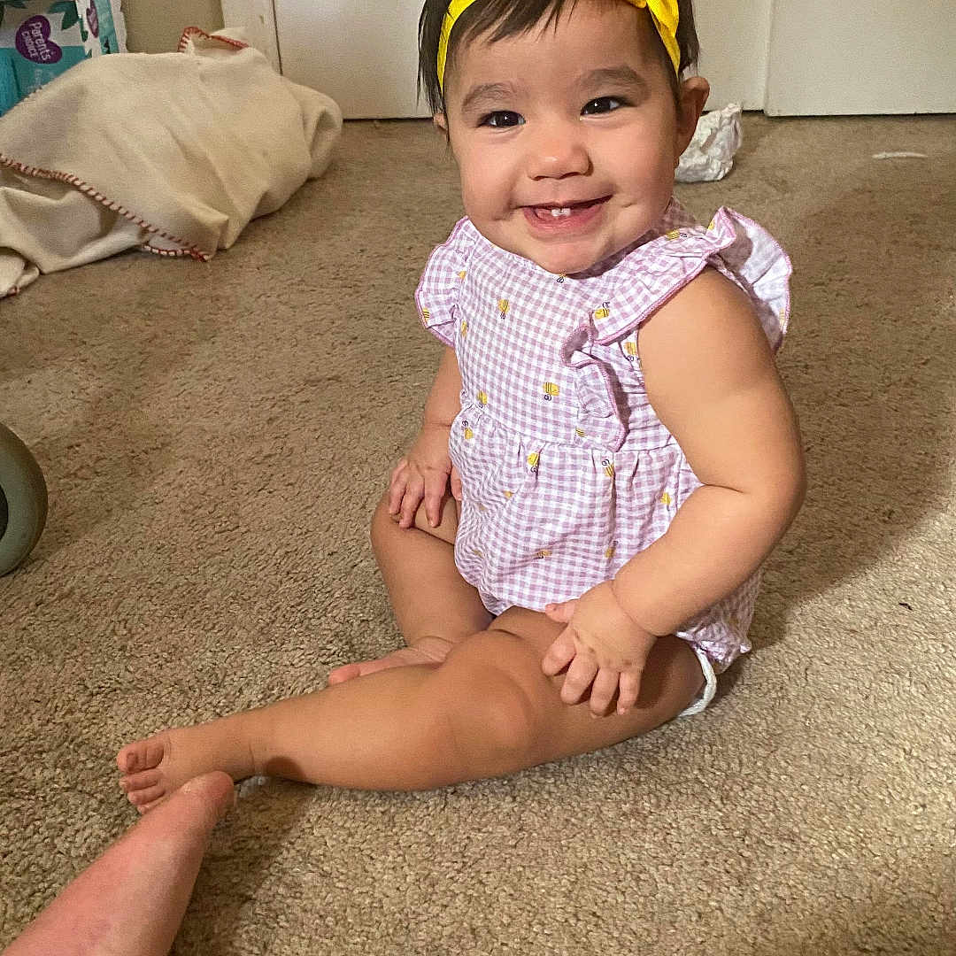 Nevaeh is registered to the contest to win money with this photo: accessories, baby, cap, clothing, couch, dress, face, furniture, happy, hat, head, homedecor, pants, person, photography, portrait, shorts, sitting, smile, t_shirt