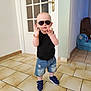 Milan a rejoint le concours — aidez-le/la à gagner de superbes lots ! toddler, child, sunglasses, black_shirt, denim_shorts, ripped_shorts, blue_shoes, bracelet, indoor, tiled_floor, door, plush_toy, wall, floor, person, standing, casual_clothing, cute, fashion, young_child