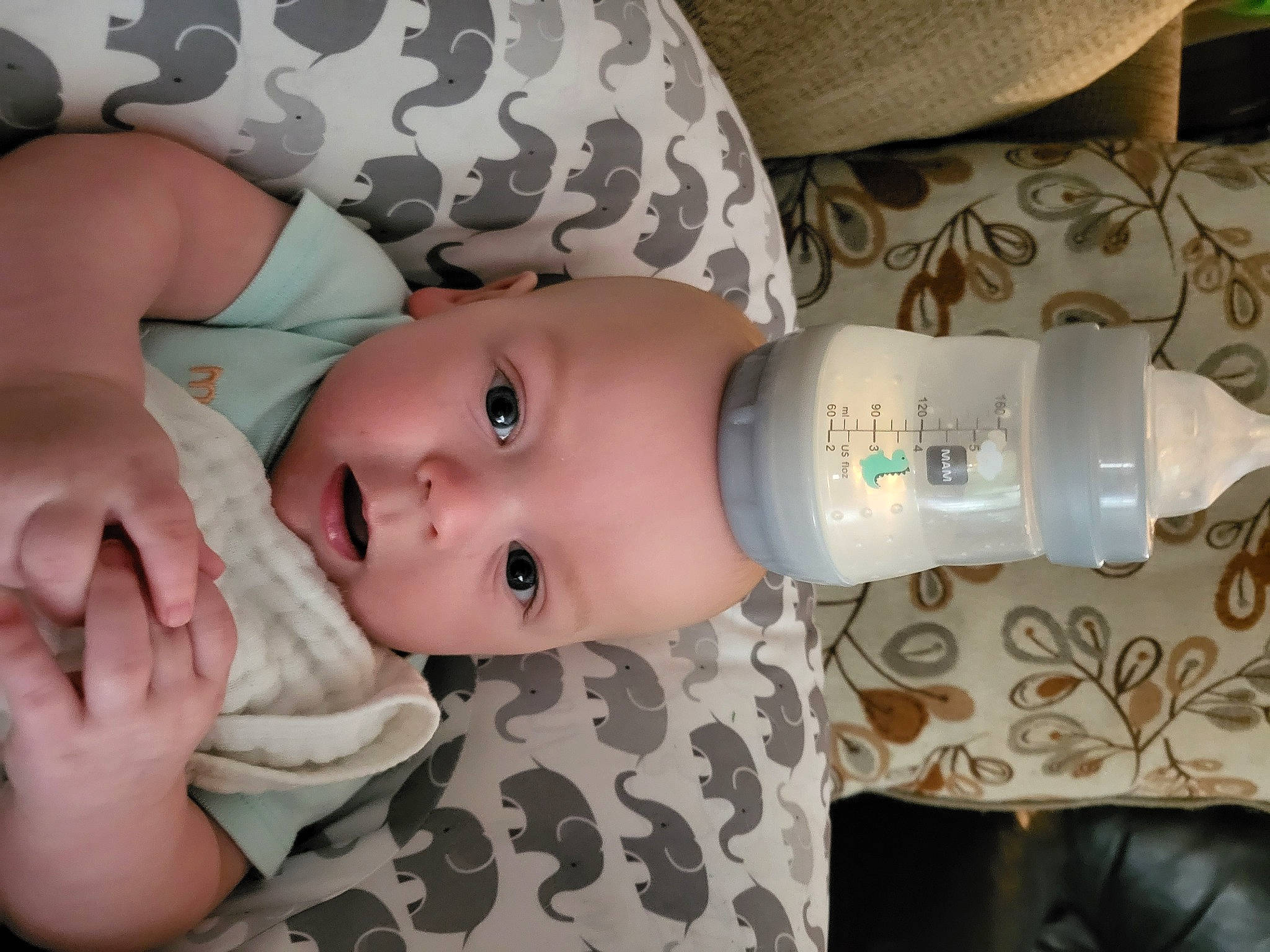 Nikolai is registered to the contest to win money with this photo: baby, baby_products, baby_toddler_clothing, bottle, cheek, chest, child, drink, drinkware, eye, eyelash, face, hand, head, human_body, iris, nail, person, skin, toddler