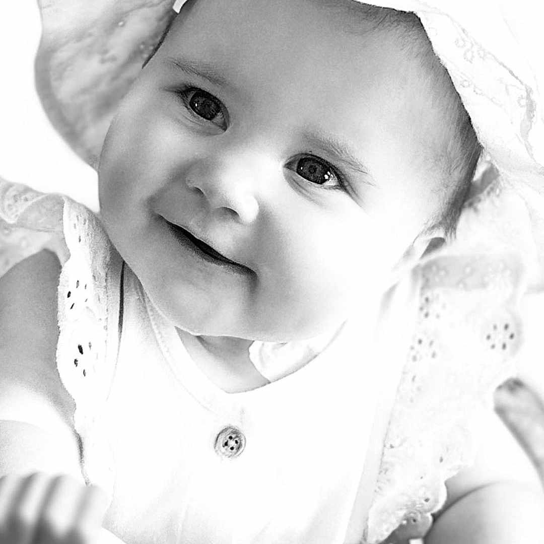Rhea joined the competition — help win amazing prizes! baby, baby_toy, black_and_white, button, child, close_up, clothing, cute, eyes, face, hand, happy, hat, infant, person, playtime, portrait, skin, smiling, toy