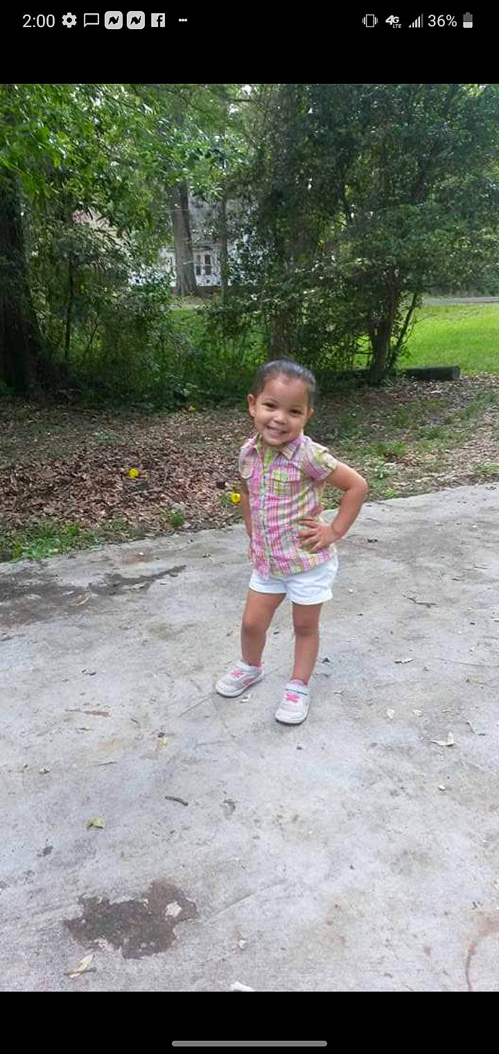 Harmony is registered to the contest to win money with this photo: asphalt, baby_toddler_clothing, child, fun, garden, grass, joy, landscape, leaf, leisure, person, plant, recreation, road, road_surface, shorts, sidewalk, smile, soil, toddler