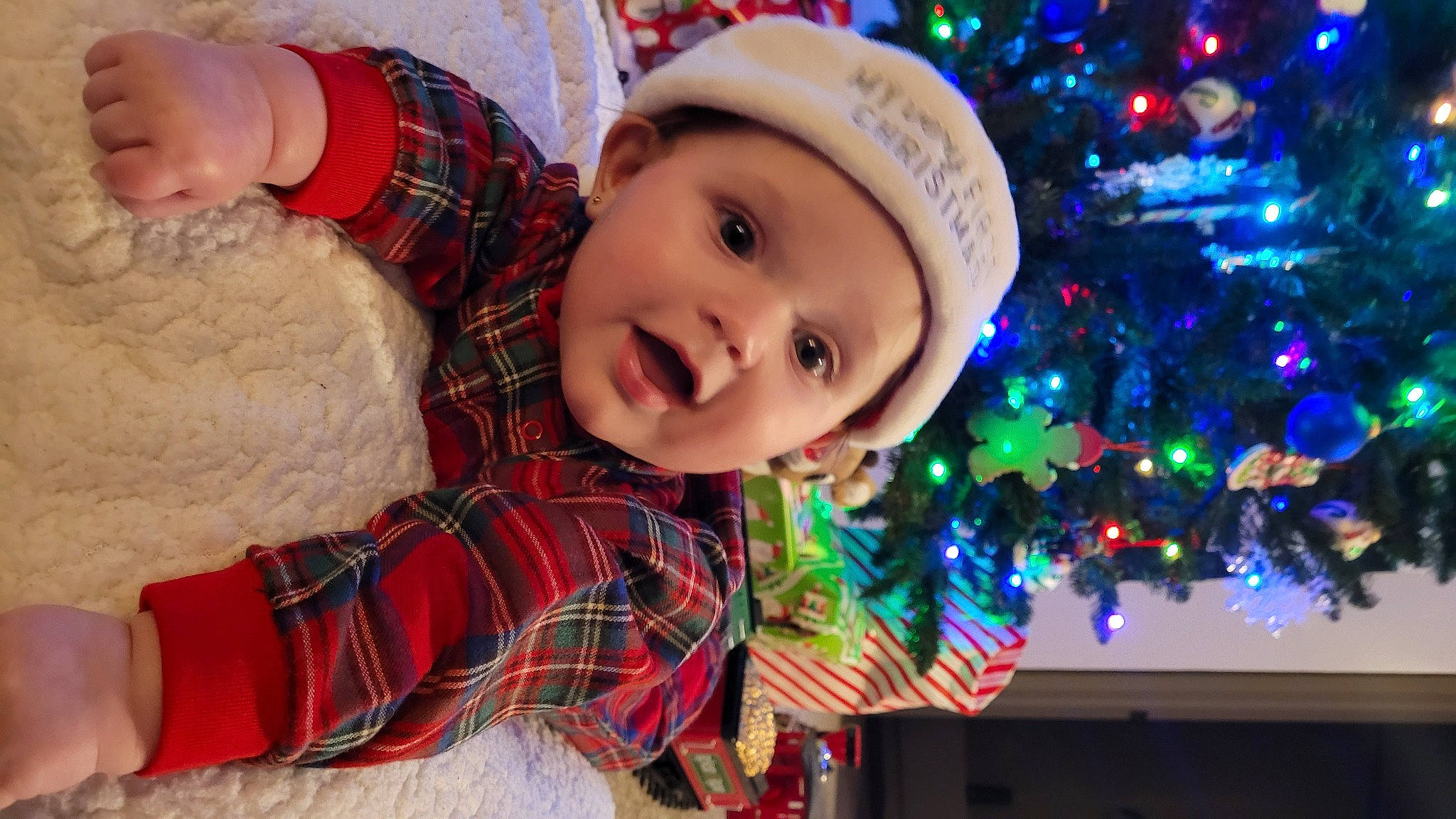 Amber joined the competition — help win amazing prizes! christmas, christmas_ornament, christmas_tree, event, fun, green, happy, headwear, holiday, holiday_ornament, human_body, light, pattern, person, plaid, plant, red, smile, surprise, tartan
