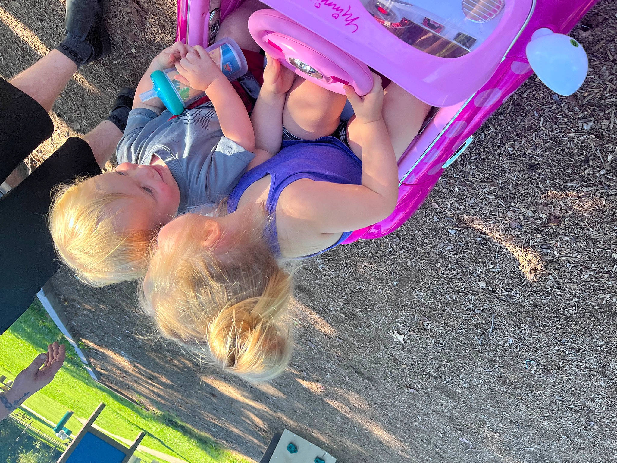 Alaiza-grace is registered to the contest to win money with this photo: bikini, brassiere, child, electric_blue, eyewear, fashion_accessory, fun, grass, happy, human_leg, leisure, magenta, people_in_nature, person, pink, recreation, shorts, sitting, soil, sun_tanning