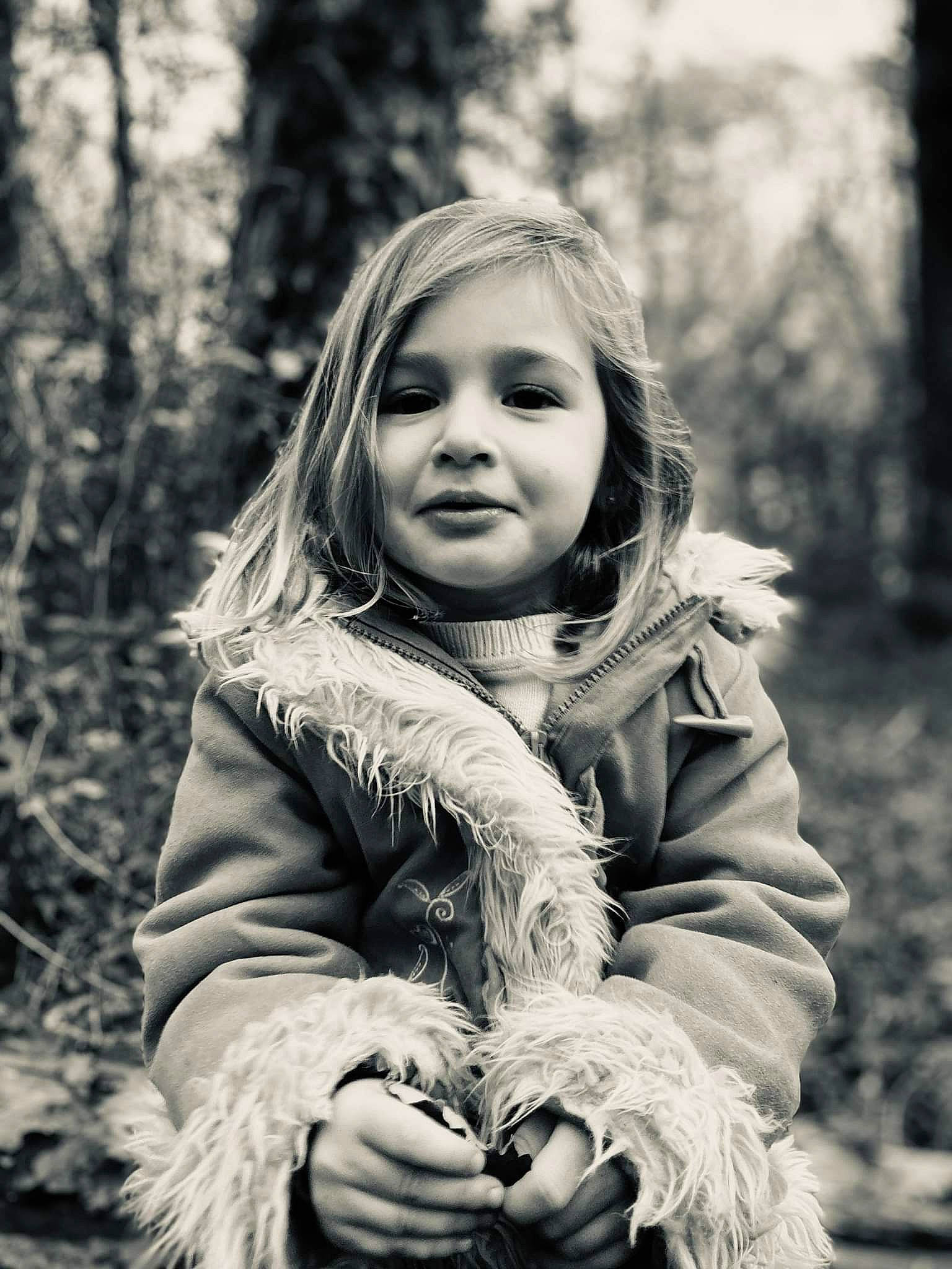 Calie participe au concours pour gagner de l'argent avec cette photo : beauty, black, black_and_white, child, flash_photography, fun, grass, happy, jacket, monochrome, monochrome_photography, outerwear, people, people_in_nature, person, plant, smile, standing, style, toddler