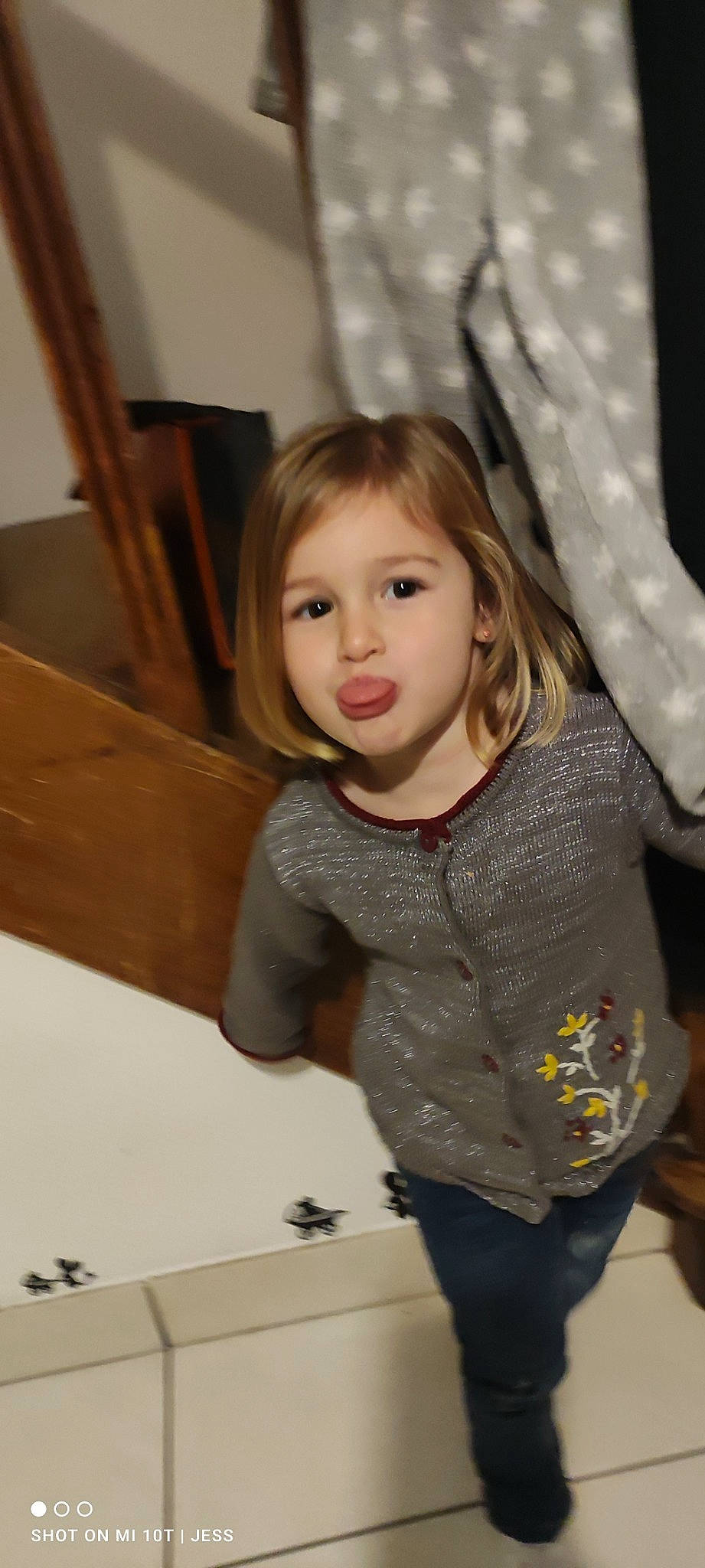 Calie participe au concours pour gagner de l'argent avec cette photo : blond, brown_hair, cheek, child, eye, flooring, fun, gesture, happy, iris, jeans, leisure, long_hair, person, skin, sleeve, smile, standing, toddler, white