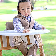 Erkhes joined the competition — help win amazing prizes! toddler, child, high_chair, outdoor, birthday, number_one, suit, shirt, sock, face, person, cute, portrait, baby, celebration, park, grass, daylight, smile, young
