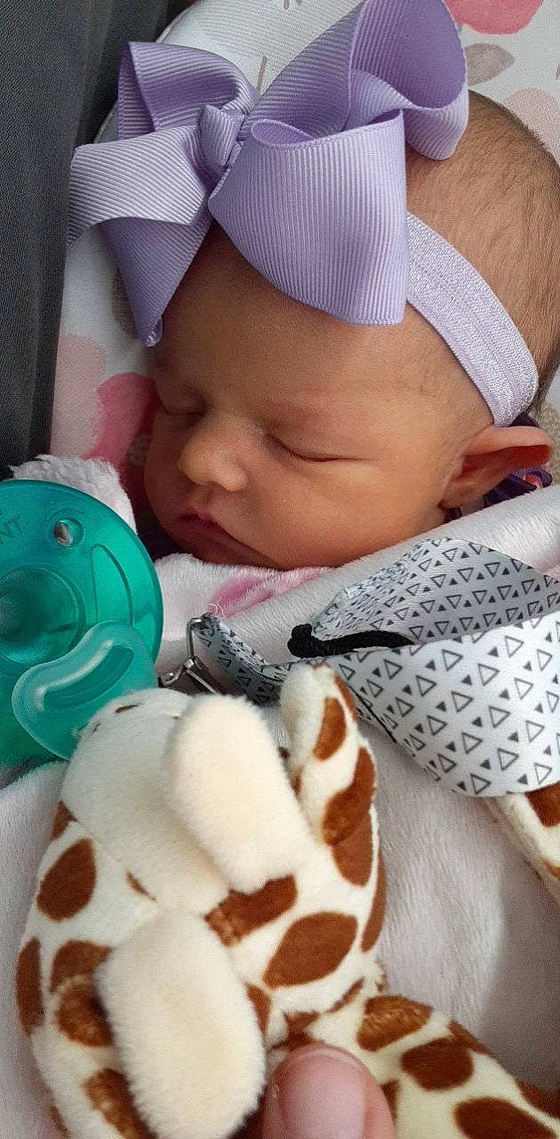 Raelynn is registered to the contest to win money with this photo: baby, baby_sleeping, baby_toddler_clothing, cap, child, comfort, comfort_food, dessert, finger, food, ice_cream, ingredient, linens, mouth, nail, person, skin, sweetness, textile, toddler