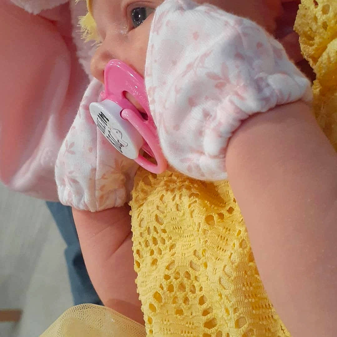Raelynn is registered to the contest to win money with this photo: baby, baby_toddler_clothing, eyelash, finger, hand, happy, headgear, human_body, lip, nail, neck, nose, pink, skin, sleeve, thumb, toddler, woolen, wrist, yellow