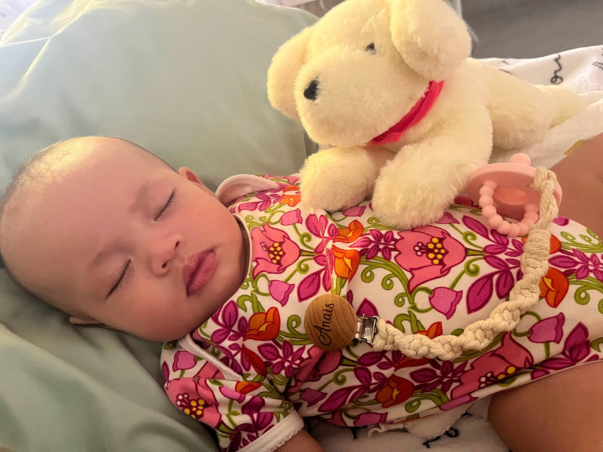 Anaïs is registered to the contest to win money with this photo: baby, baby_toddler_clothing, cheek, child, comfort, fur, happy, linens, nose, organ, pattern, person, pink, plush, room, skin, stuffed_toy, teddy_bear, textile, toddler