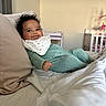 Lailani Jackson is registered to the contest to win money with this photo: baby, bed, bib, child, cozy, crib, cute, furniture, happy, indoor, infant, mobile, nursery, onesie, person, pillow, relaxed, room, sleepwear, smile