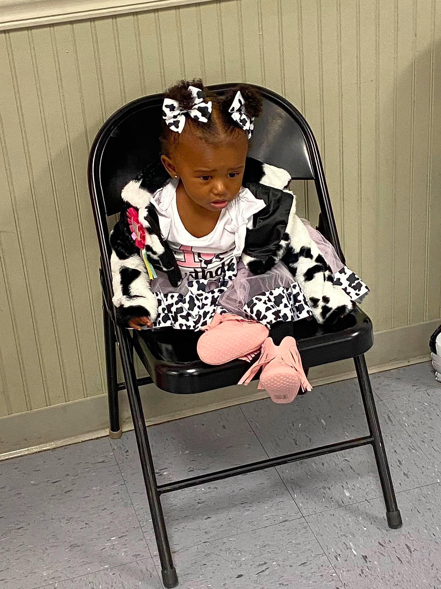 Valencia joined the competition — help win amazing prizes! baby_products, baby_toddler_clothing, black_hair, chair, child, eyewear, fashion_accessory, hat, human_leg, knee, pattern, person, shorts, sitting, sleeve, t_shirt, tints_and_shades