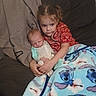 child, baby, newborn, sibling, blanket, stitch, couch, clothing, red_shirt, gray_hoodie, indoor, family, hugging, comfort, cute, portrait, person, young_child, toddler, love
