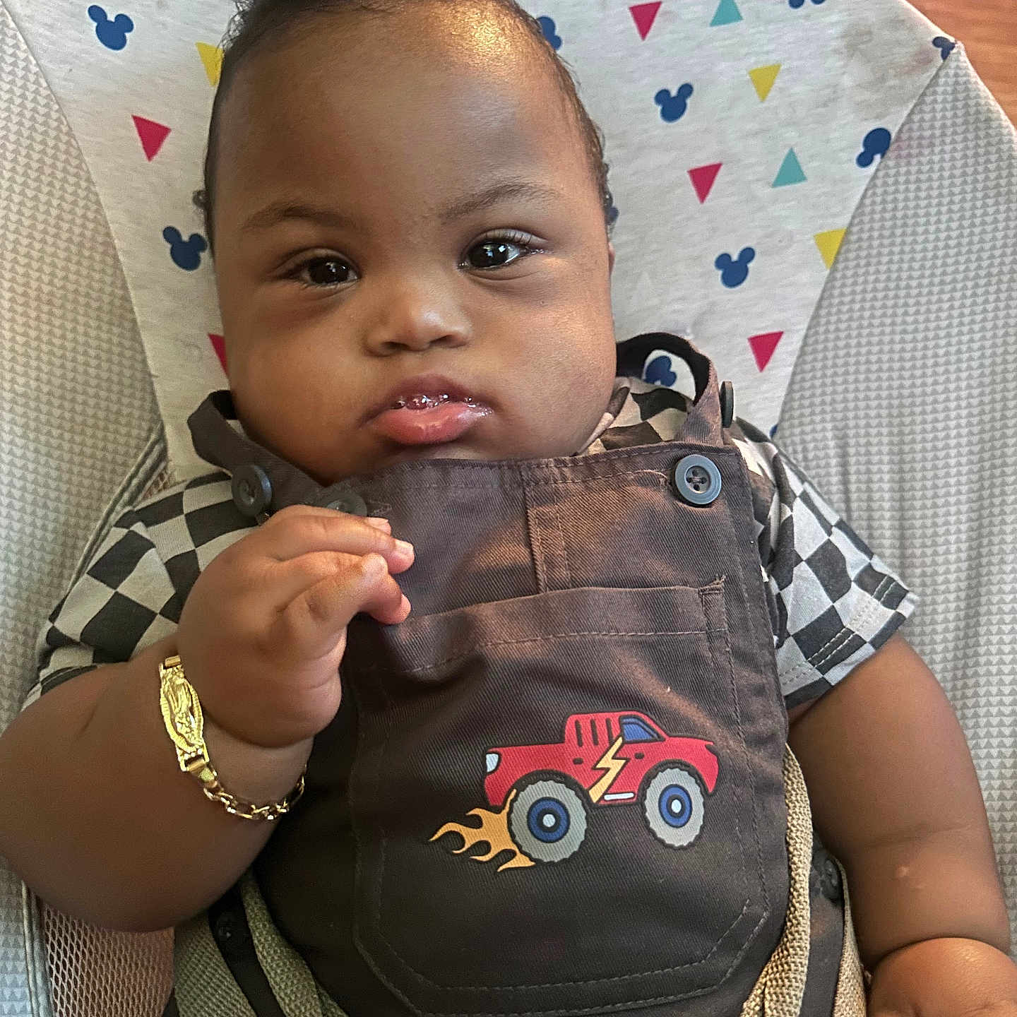 Karter is registered to the contest to win money with this photo: accessories, baby, bag, bodypart, clothing, coat, cushion, cutlery, face, finger, furniture, hand, head, homedecor, jacket, person, photography, portrait, sitting, spoon