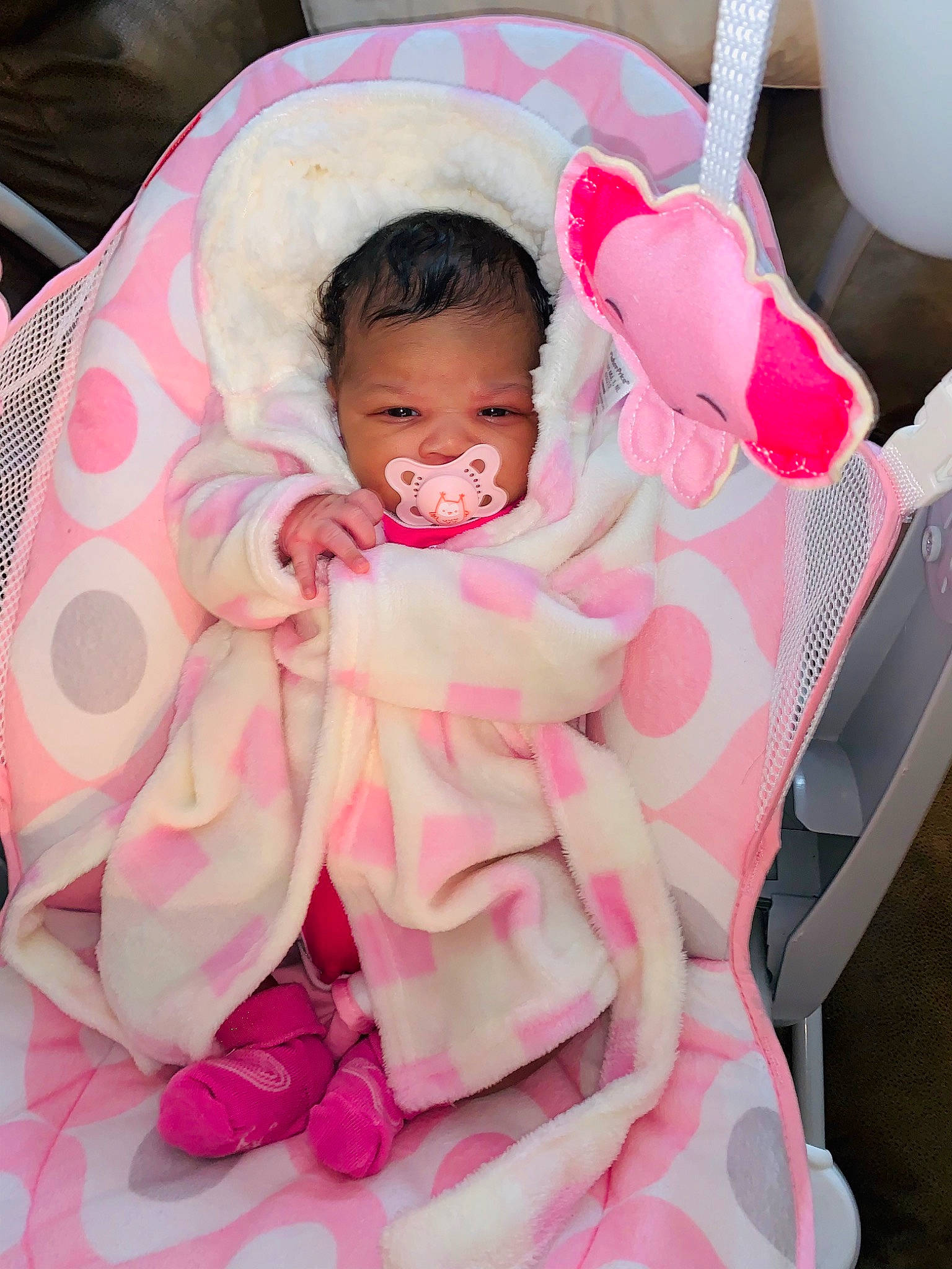 Journee joined the competition — help win amazing prizes! baby, baby_carriage, baby_products, baby_safety, baby_toddler_clothing, cheek, child, comfort, cradle, eye, happy, infant_bed, linens, magenta, person, pink, sitting, sleeve, smile, textile