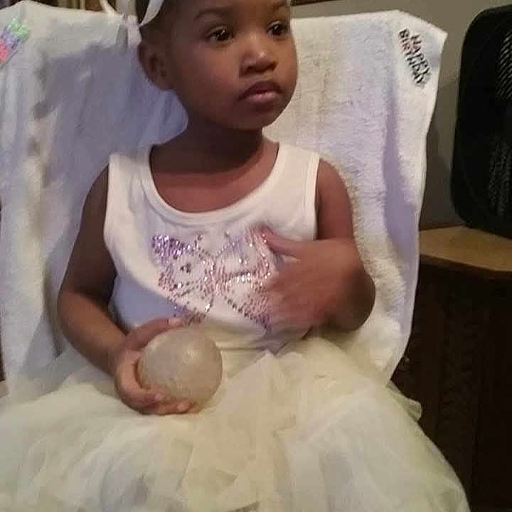 Na'Day'a joined the competition — help win amazing prizes! ball, chair, child, crown, cute, decor, dress, expression, furniture, girl, hands, home, indoor, person, portrait, seated, tiara, towel, white, young