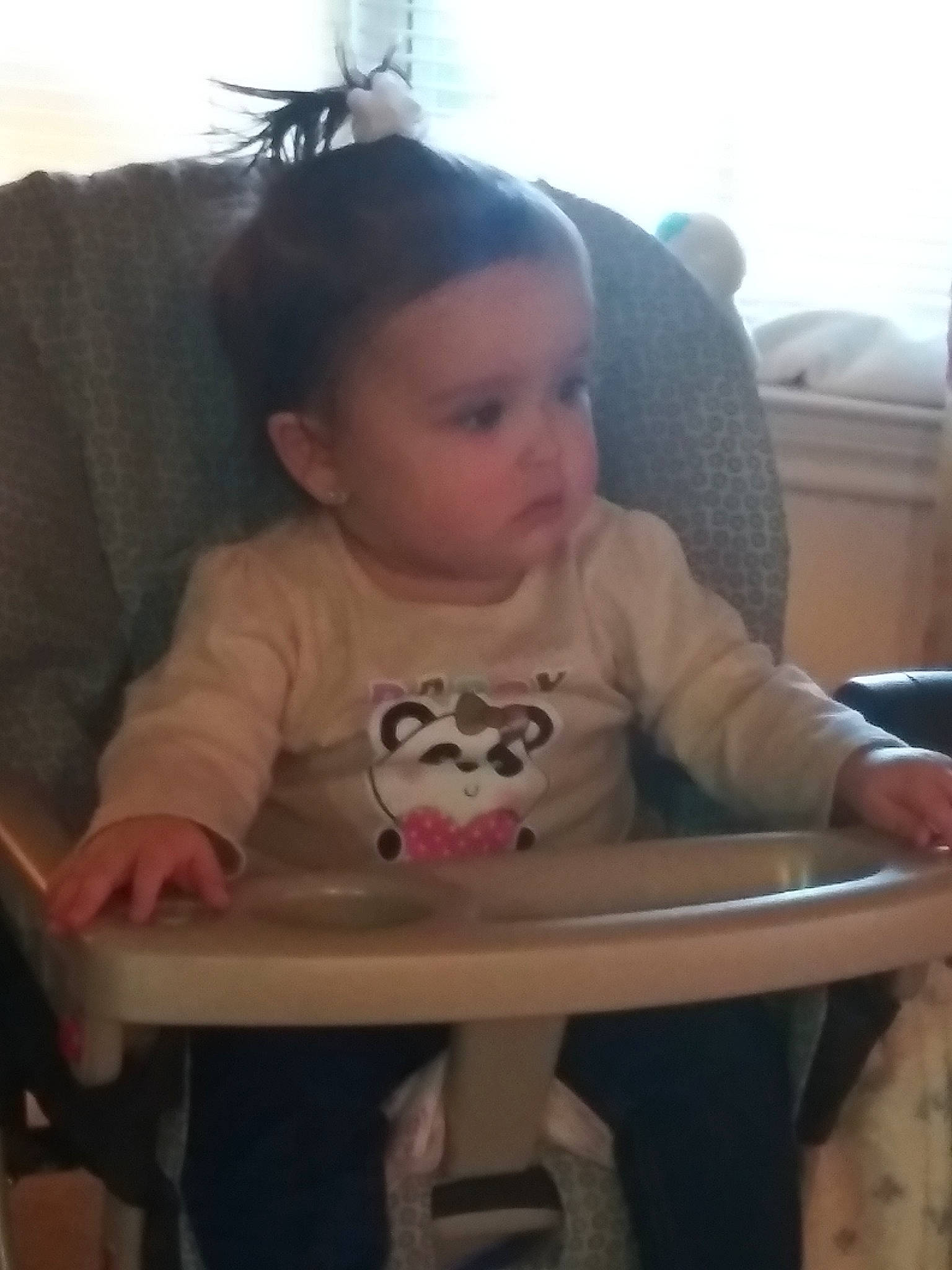 Charity is registered to the contest to win money with this photo: arm, baby_products, cheek, child, day, ear, eye, face, finger, fun, furniture, girl, head, infant, mouth, person, play, product, sitting, skin