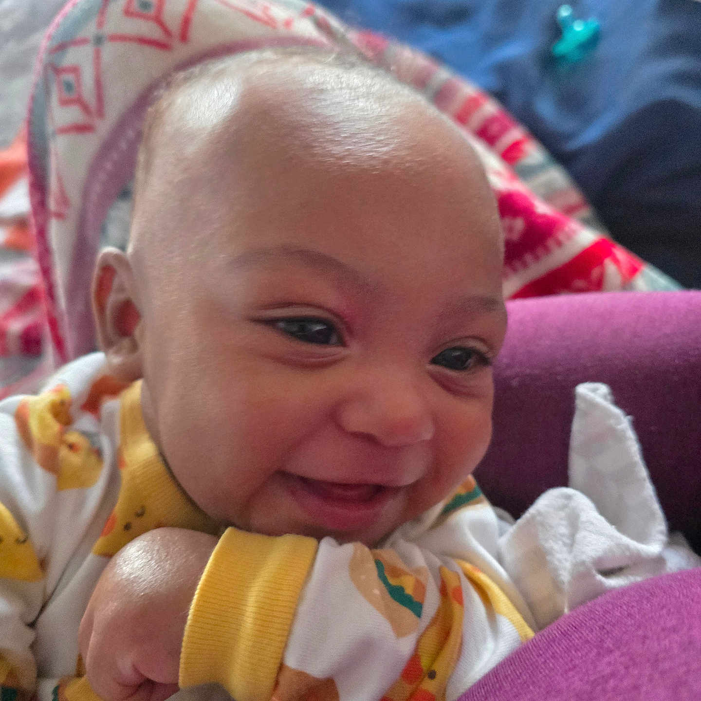 Mas joined the competition — help win amazing prizes! baby, infant, child, smiling, happy, portrait, close_up, face, eyes, bald, baby_clothes, colorful_clothing, blanket, cushion, tissue, indoor, seated, adorable, family, photography