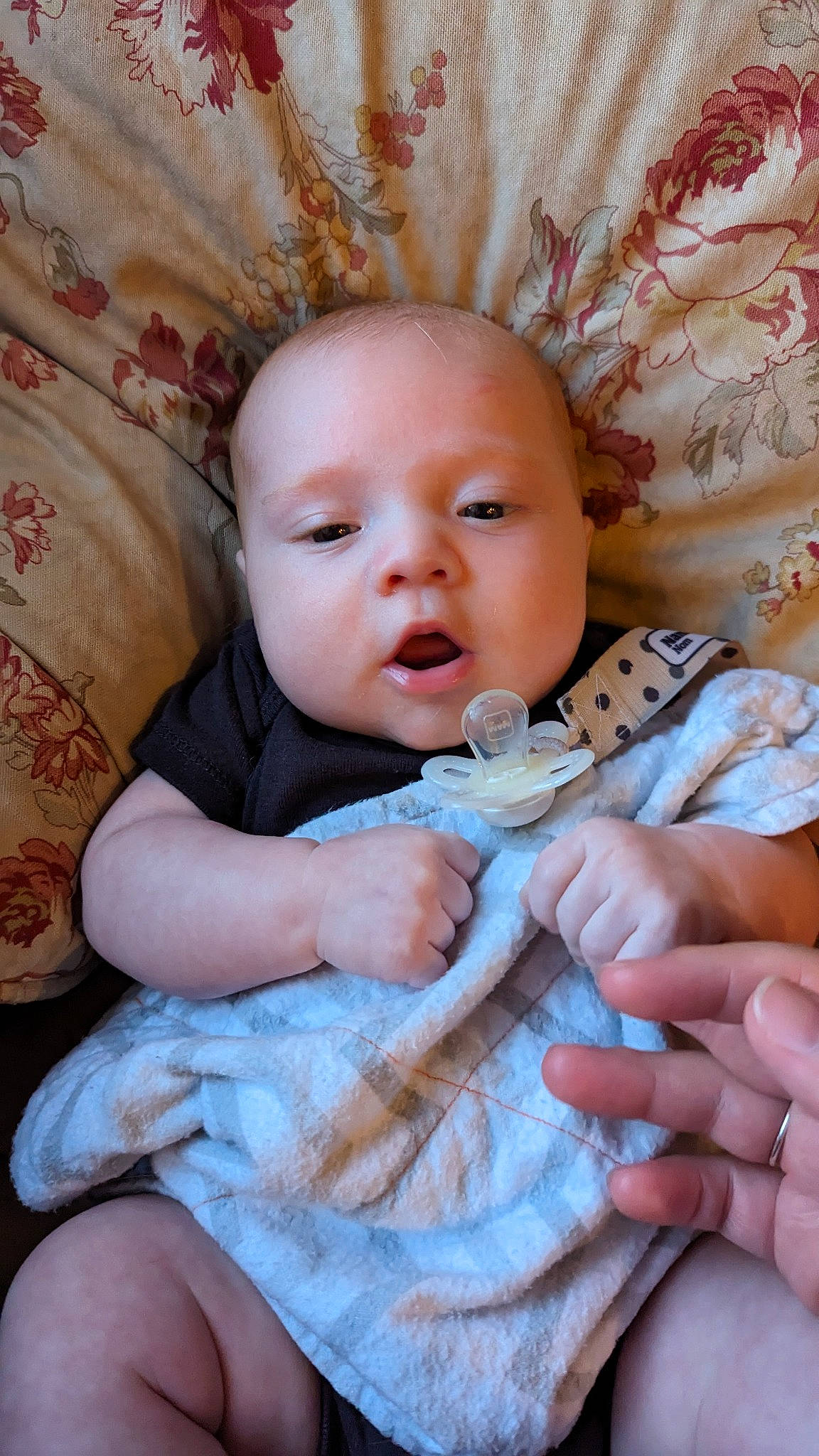 Rin is registered to the contest to win money with this photo: baby, baby_toddler_clothing, cheek, chin, comfort, eye, face, finger, gesture, hand, head, human_body, iris, lip, mouth, nail, nose, person, pink, skin